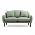 Sofá de dos plazas en color verde claro con cojines y patas de madera 150 x 80 x 75cm